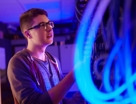 Student looking wires
